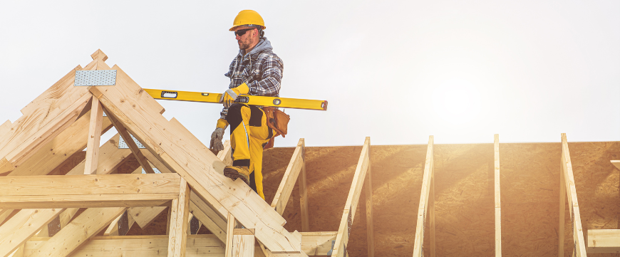 construction worker on roof trusses