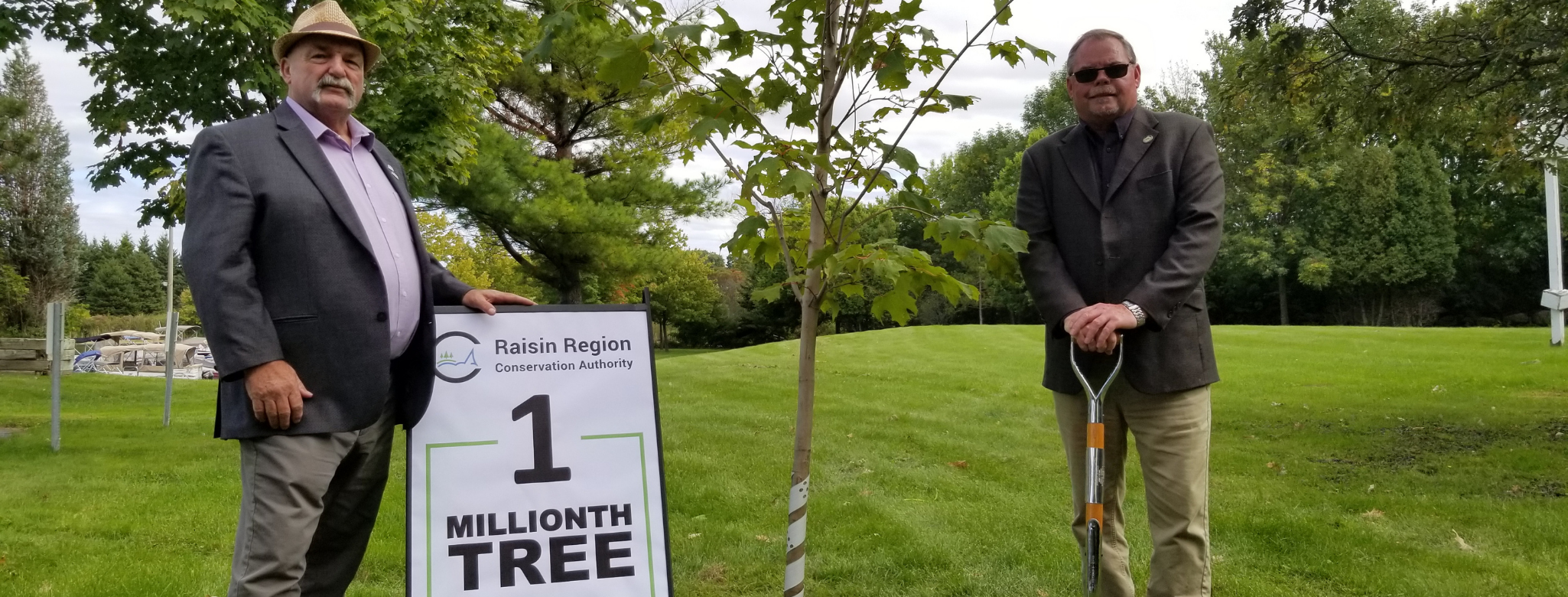 Mayor and Deputy Mayor next to 1 millionth tree planted