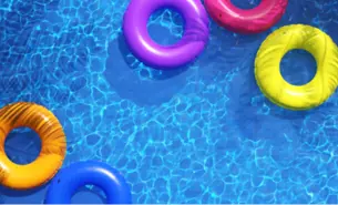 Pool water with coloured inner tubes